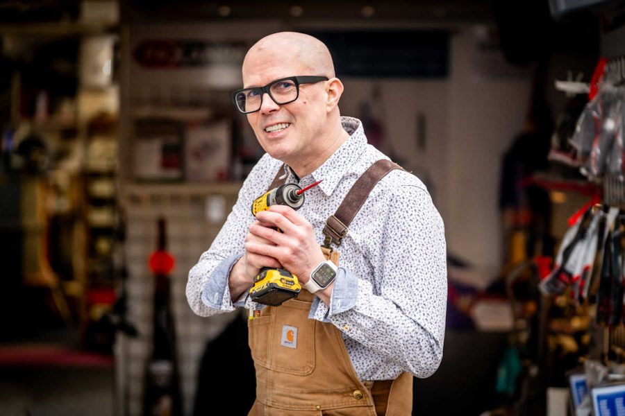Dyson Doctor Nik Grey holding his favourity Dewalt tool.